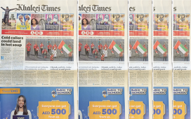 Khaleej Times Sharaf DG mixed reality ad plays video on paper