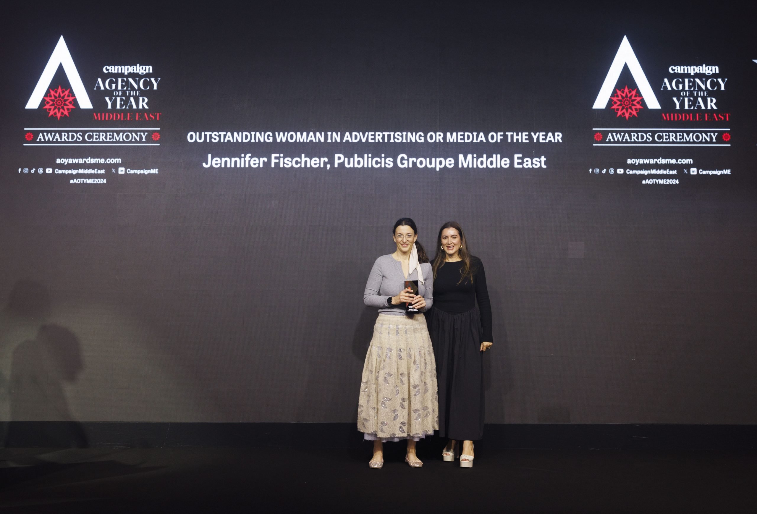 Marie-Capucine Maloy, Global Senior Director of Communications at Huda Beauty, handed over the Outstanding Woman in Advertising or Media of the Year trophy to Jennifer Fischer from Publicis Groupe Middle East.