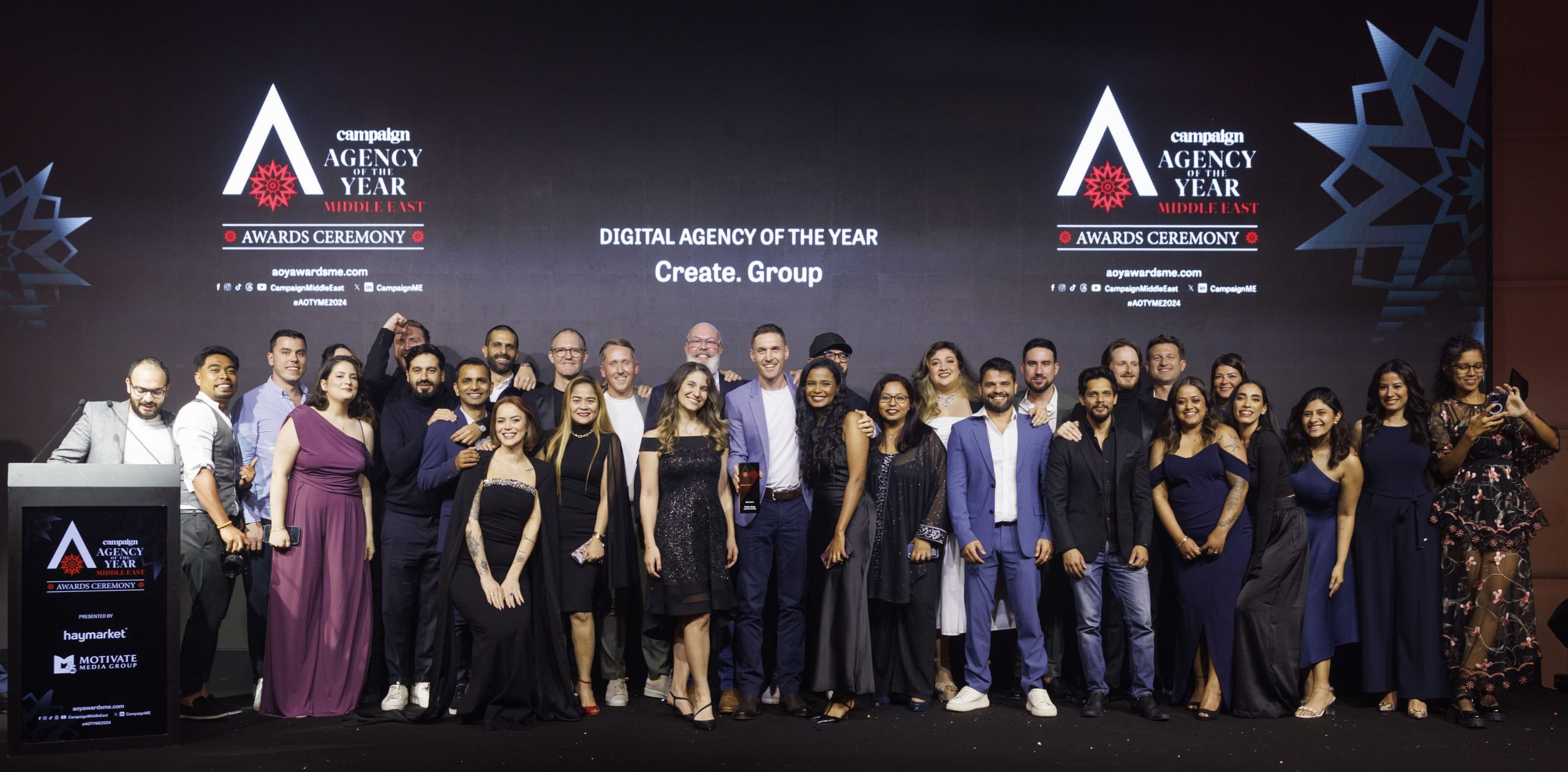 Create. Group posed for a photograph on stage after picking up the Digital Agency of the Year award from awards sponsor Sherry Mansour, Managing Director – MENAT at Seedtag.