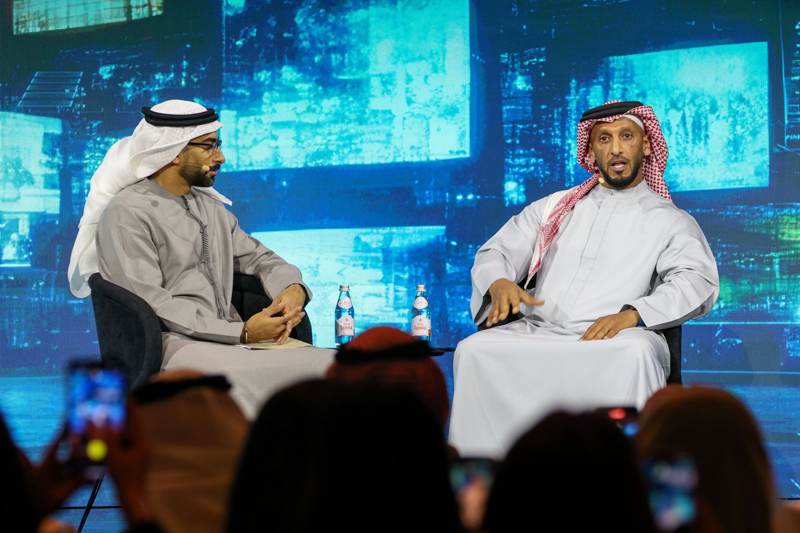 From left to right, Anas Bukhash, Entrepreneur and Interviewer, Host of #ABtalks, on stage with His Excellency Abdulla bin Mohammed bin Butti Al Hamed, Chairman of the National Media Office and Chairman of the UAE Media Council discussing the BRIDGE initiative.