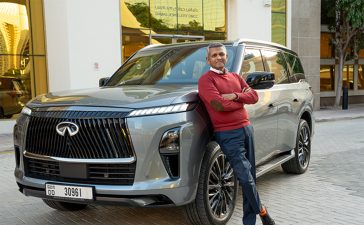 Rajnish Damodaran, Director of Retail, Product and Marketing at Damas Jewellery, stands next to the INFINITI QX80.