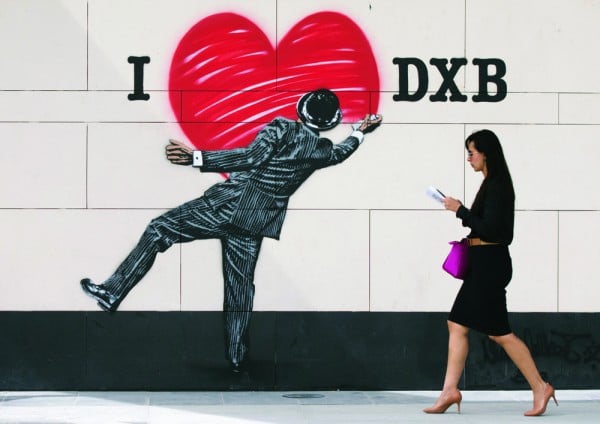 A woman walking past a piece by British stencil artist Nick Walker, at the launch of Dubai Walls at City Walk, Dubai - the first large-scale collection of street art in the Middle East, featuring 14 of the world‚¬Ä¬ôs top street artists representing five continents.